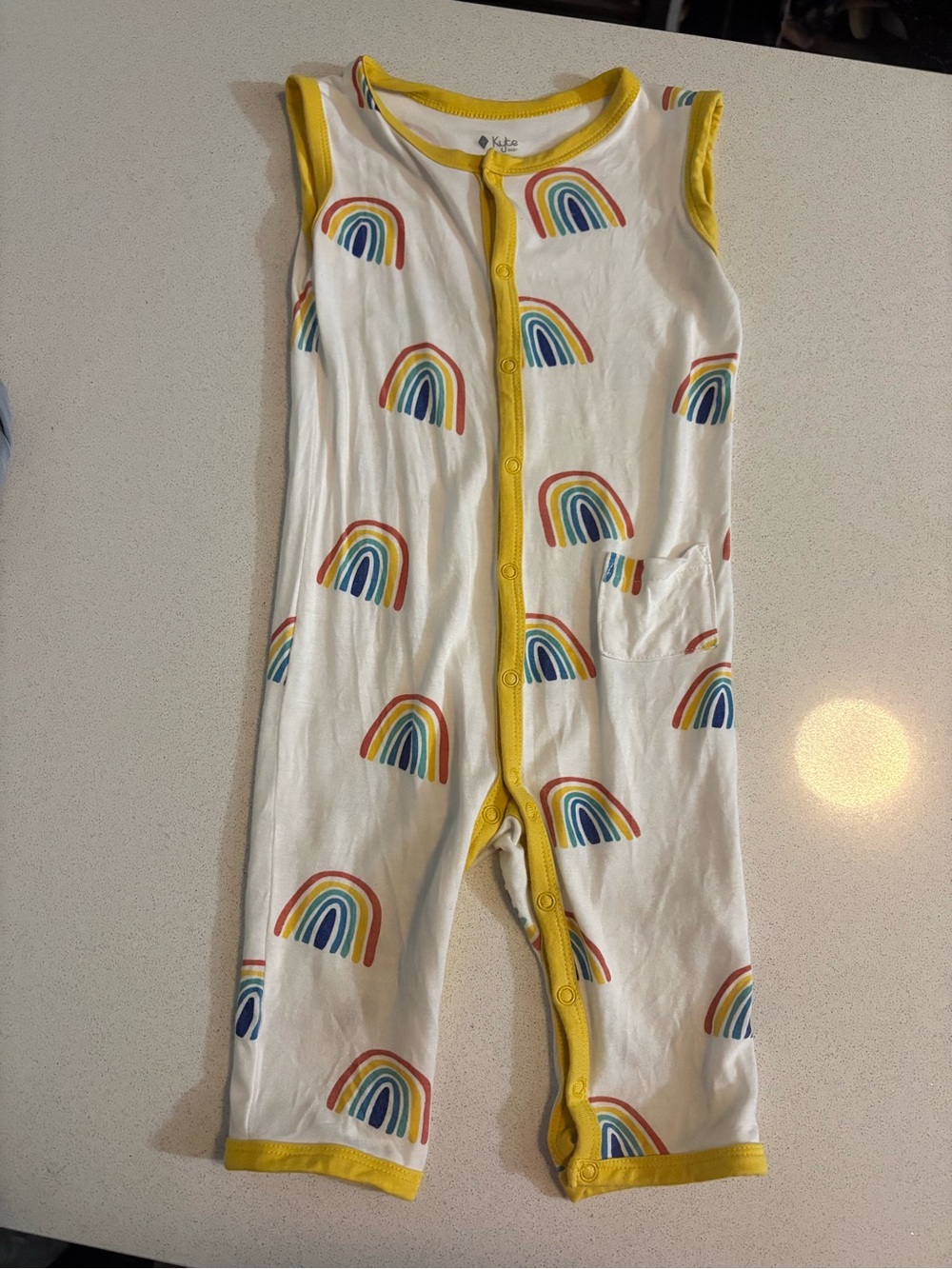 Kyte BABY White Sleeveless Romper with Yellow Trim in Pineapple Rainbow Print